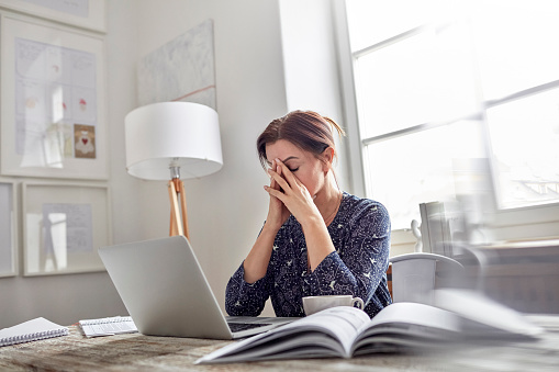 financial terms Woman Holding her Face