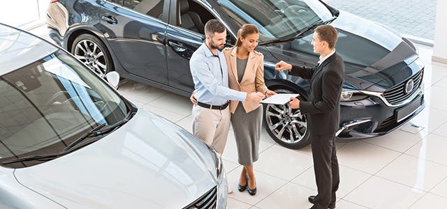 Happy Couple at car dealership