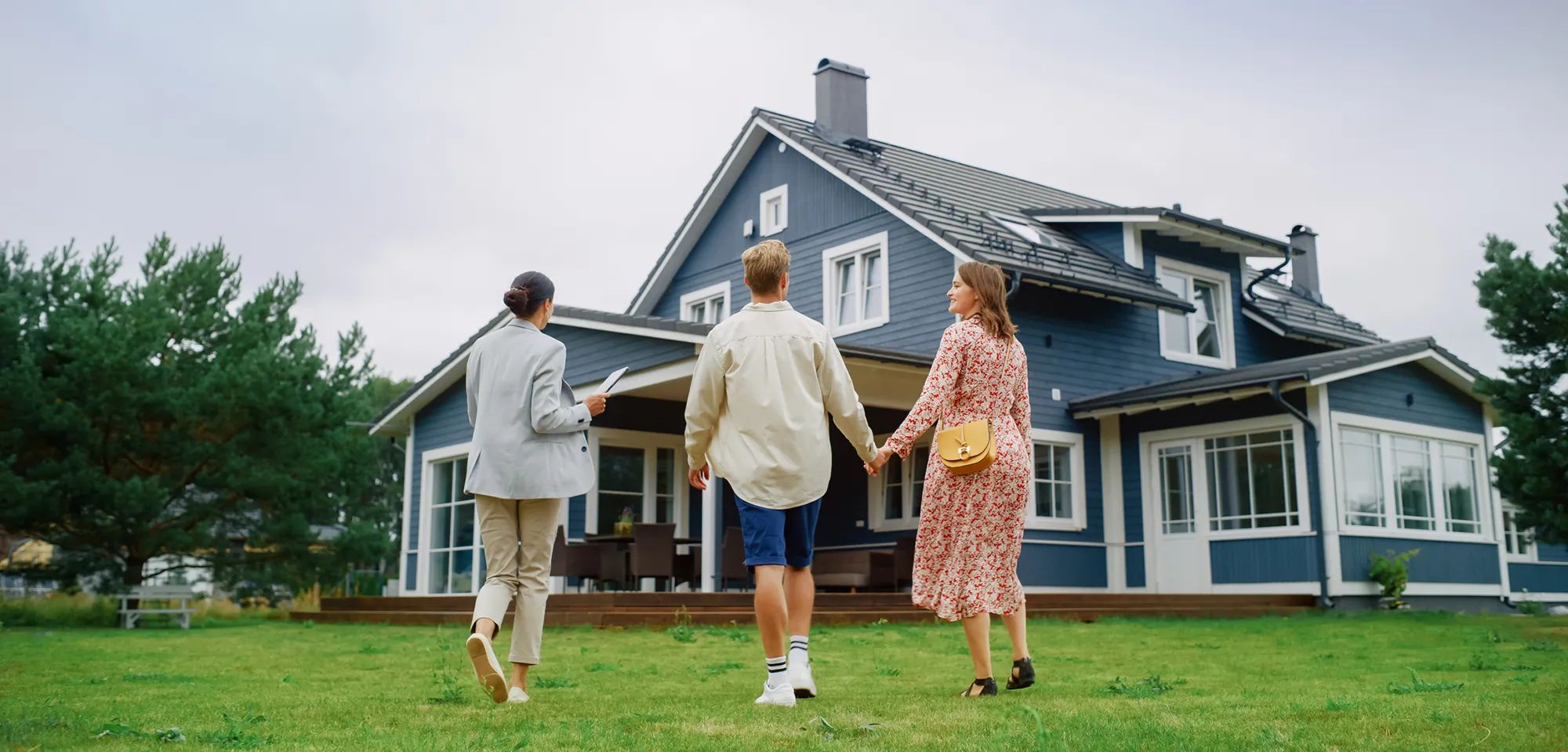 A couple viewing a home with a real estate professional.
