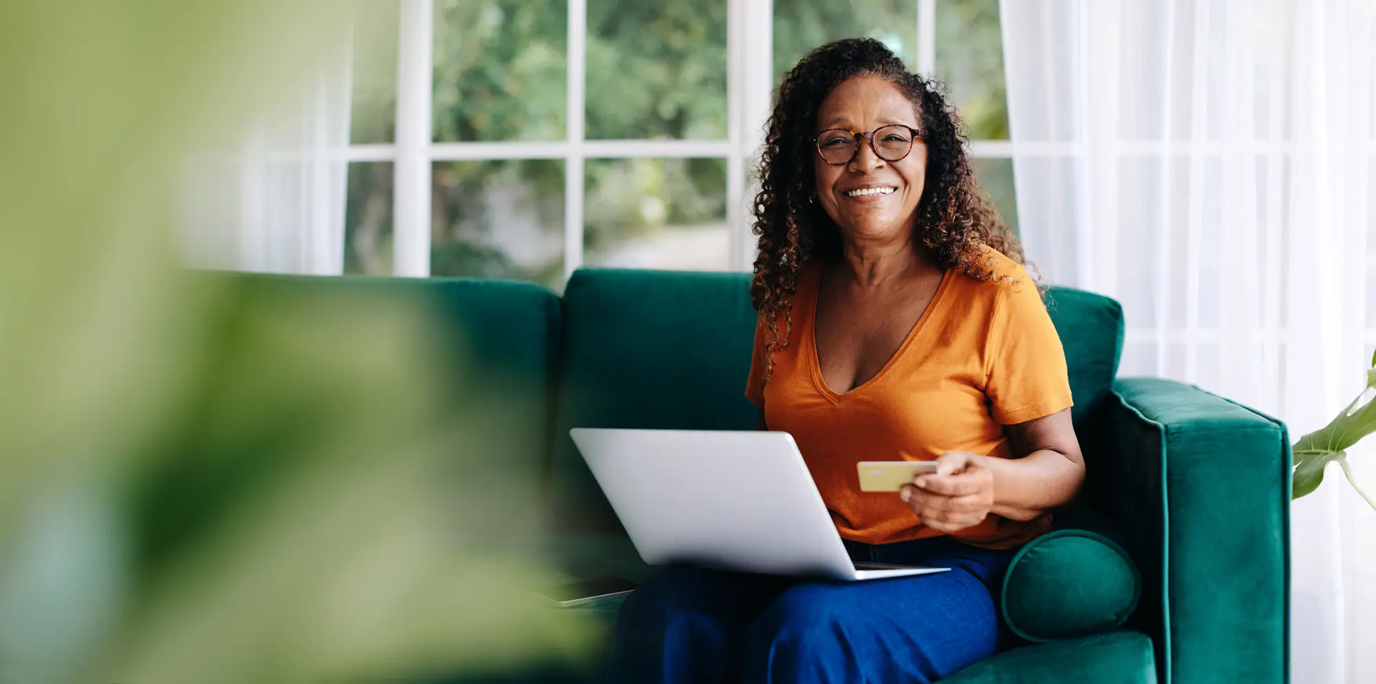 Woman on couch with laptop