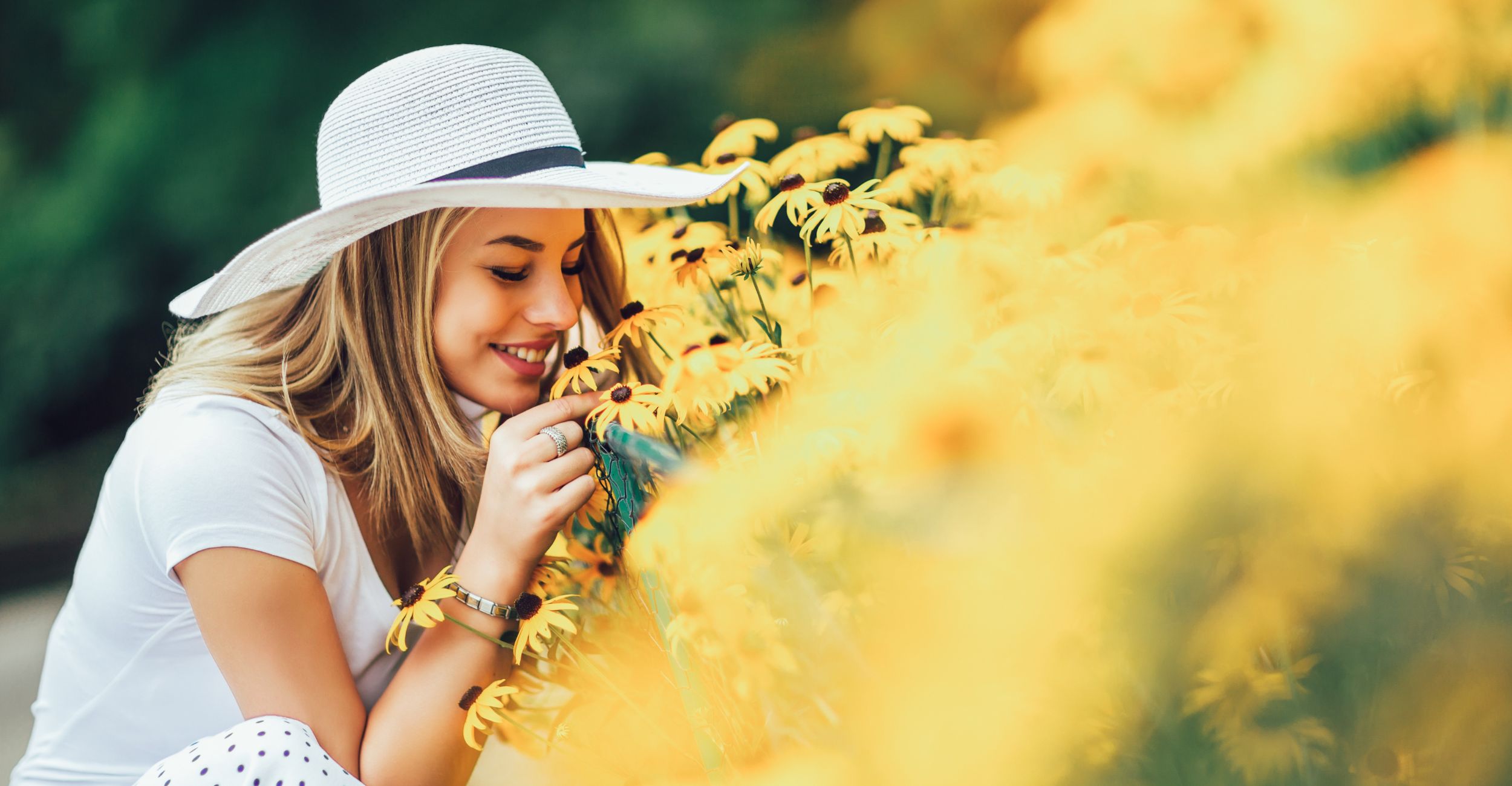 Woman smelling flowers