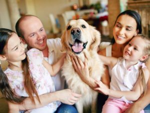 family with their dog